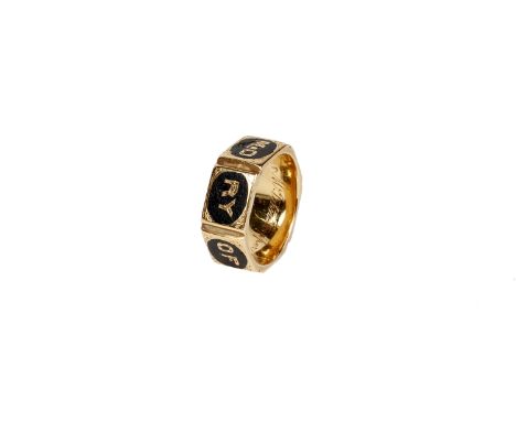 A Victorian 18k gold and black enamel mourning ring. Hexagonal design with black enamel lettering 'In Memory of' and vacant r