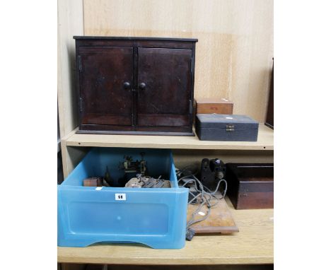 Clock &amp; watch making tools and parts to include clamps, boxes, treen containers, drills boxes and a lathe. 