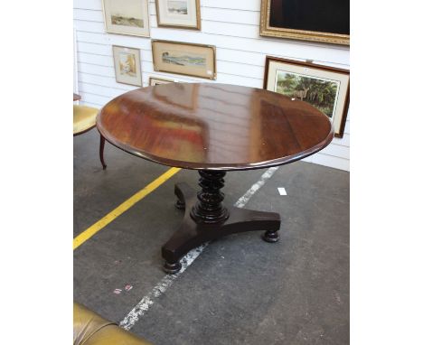 A 19th century tilt top circular breakfast table on turned single support on tripod base. 107cm