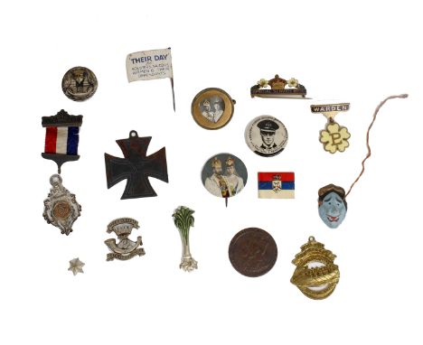 A selection of badges, silver watch fobs, an enamel wardens badge and other items. 