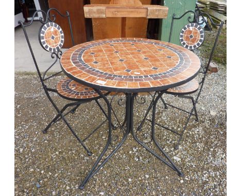 Garden circular metal and tile top table and two making folding chairs 