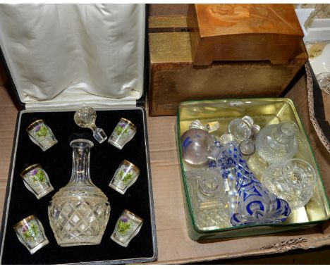 Cased cut glass decanter and set of six shot glasses with thistle decoration, small selection of scent bottles, wooden boxes,