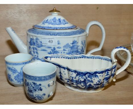 Cream ware blue and white gravy boat, two blue and white cups (1 A/F) and an oriental blue and white teapot