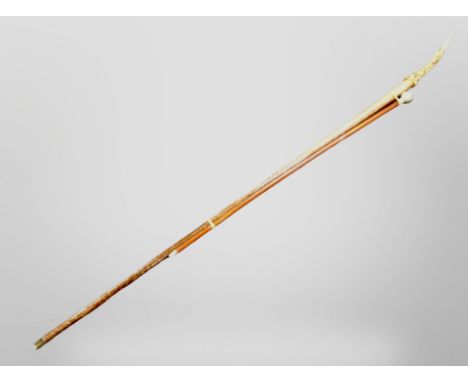 An antler handled walking stick and a swagger stick 