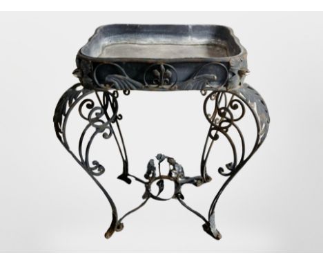 A wrought metal lead lined planter, height 96 cm 