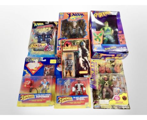 A group of Kenner and Toy Biz figurines, including Superman, Spider-Man, X-Men, etc., all in retail packaging.