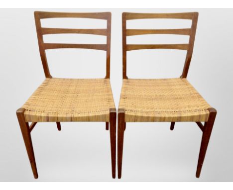 A pair of 20th century Danish teak ladder back chairs with cane seats 
