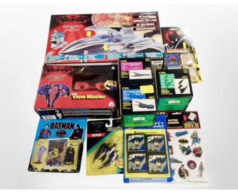 A collection of Batman toys and figurines by Kenner and other brands, including model Jetblade, a View-Master Batmobile model