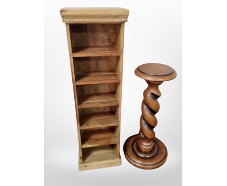 A contemporary mangowood narrow CD shelf and a torchere 