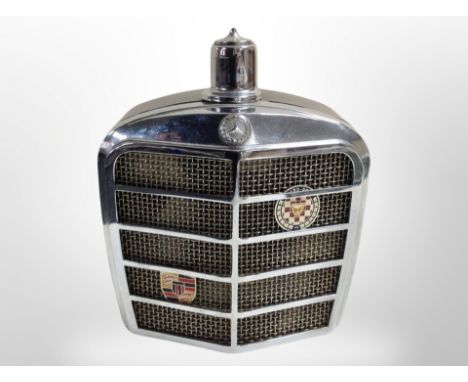 A musical decanter in the form of a car radiator grill.