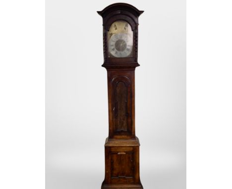 A 19th century continental oak longcase clock with brass and silvered dial, with pendulum and weights, height 222 cm 