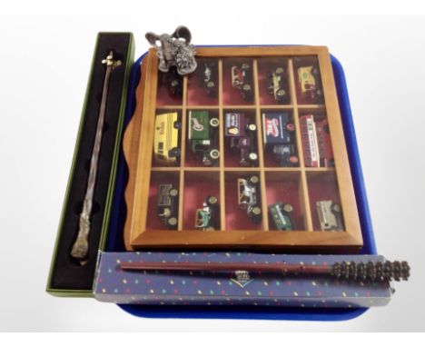 A display box of die cast vehicles, pewter Myth and Magic figure, Harry Potter Ron Weasley wand etc 