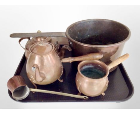 A 19th century copper and cast iron cooking pan, together with a kettle, coffee pot, measuring ladle, etc.