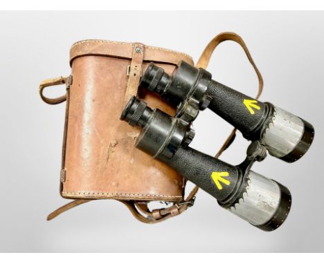 A pair of Barr & Stroud 7X CF25 binoculars, dated 1949, with military arrow markings in yellow paint and patented retractable