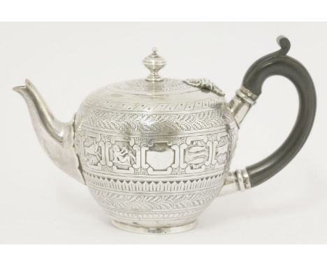 A Victorian silver bachelor's 'zodiac' teapot,by Charles Stuart Harris, London 1876,having a central band of square cartouche