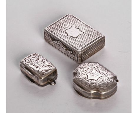 A Victorian silver vinaigrette,by Nathaniel Mills, Birmingham 1838,of engine turned rectangular form, with foliate thumbpiece