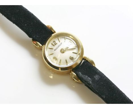 A ladies' cased 18ct gold Jaeger-LeCoultre mechanical strap watch c.1950 , 13.3mm diameter, silvered dial with raised batons 