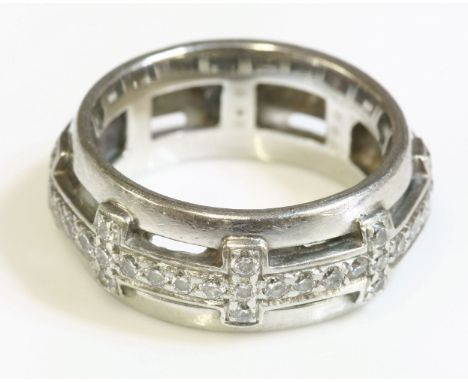 A diamond set band ring,8mm wide, with a central flat section band, grain set with a row of brilliant cut diamonds with evenl