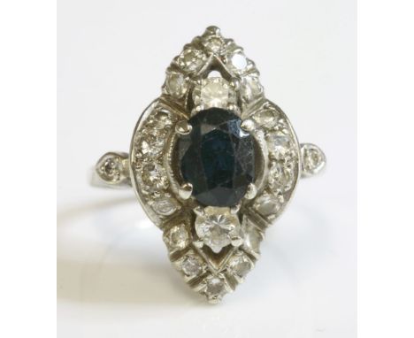 A marquise shaped sapphire and diamond cluster ring,with an oval mixed cut sapphire, four claw set to the centre, with an und