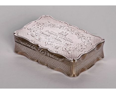 A Victorian silver table snuff box, by Henry Aston, Birmingham 1864, of shaped rectangular form, with engine turned decoratio