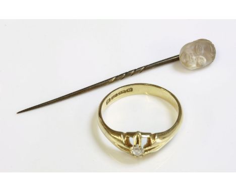 A gentlemen's 18ct gold single stone diamond ring,together with a carved glass stick pin,depicting the face of the Man in the