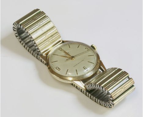 A gentlemen's 9ct gold Tudor Royal mechanical watch, c.1950,on a later gold-plated expanding bracelet.  Circular silvered dia