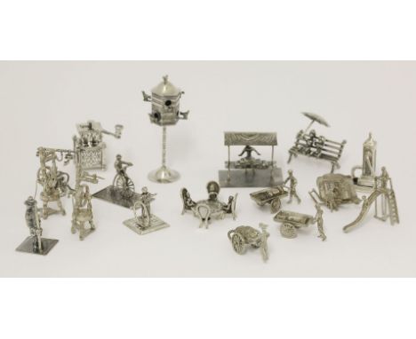 A quantity of Continental silver miniature figurines,including a dovecote, telephone, coffee grinder and children on a slide,