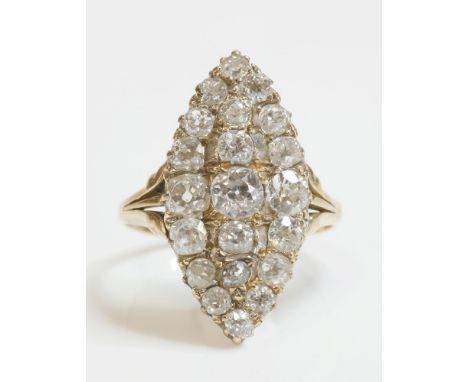 An Edwardian diamond set marquise shaped cluster ring,with graduated old European cut diamonds, all claw set to a marquise he