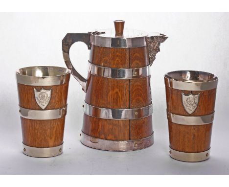 A Victorian oak beer jug with silver-plated mounts,possibly by John Dyson, Leeds c.1890,of coopered tapering cylindrical form