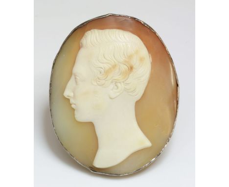 A Victorian carved shell cameo brooch,of a young gentleman facing left, in light buff to a tan ground.  Probably a later or r