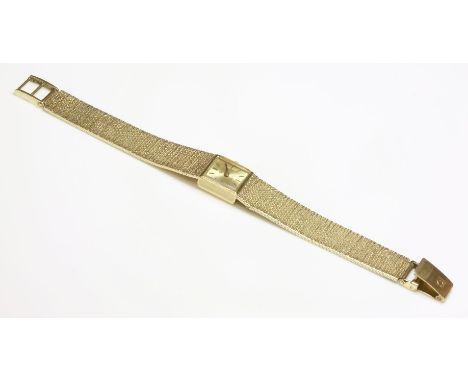 A ladies' 9ct gold Omega mechanical bracelet watch,with a square champagne dial and raised gilt and black batons.  Integral M