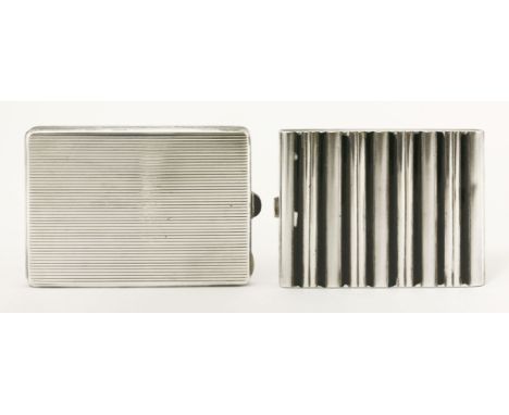 An Austrian silver cigarette case,early 20th century, of reeded rectangular form, with a black plastic hemispherical button, 