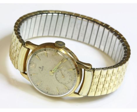 A gentlemen's 9ct gold Tudor mechanical strap watch, c.1950,on a later gold-plated expanding bracelet.  A silvered engine tur