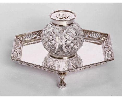 A Victorian silver inkstand,by John Figg, London 1870/71,of hexagonal form, the pierced border with swags and bead edges, on 