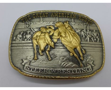A solid sterling silver, layered with 24kt gold buckle Steer Wrestling, 152g