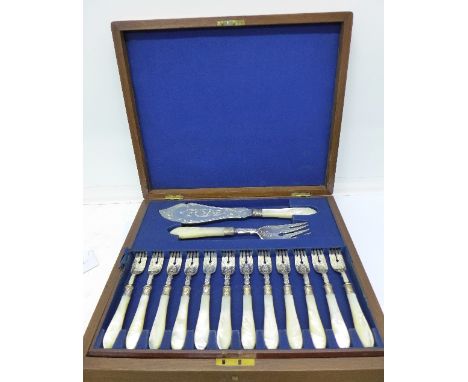 A Victorian twenty-six piece silver and mother of pearl fish knife and fork set, Sheffield 1870, Martin Hall & Co., in a waln