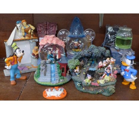 Disney collectables including a Snow White water feature, a Nightmare Before Christmas musical globe, a Fantasia globe, a/f, 