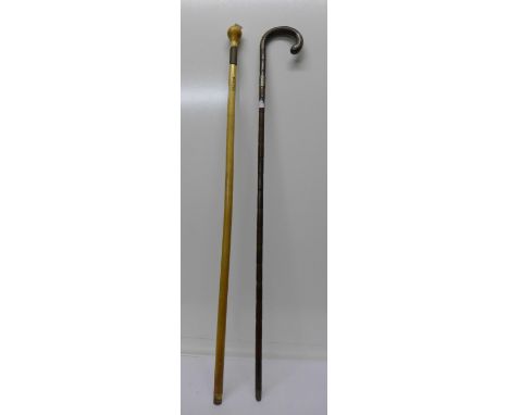 A bamboo walking stick with silver mounts and a NCB walking cane (2)