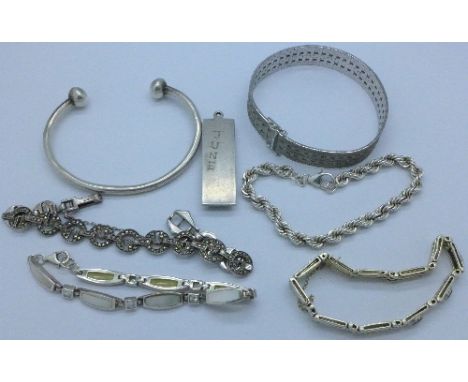 Five silver bracelets, a silver bangle and a silver ingot pendant, ingot a/f, 118g