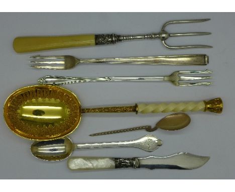 Two silver spoons and a silver pickle fork, 66g and other plated cutlery