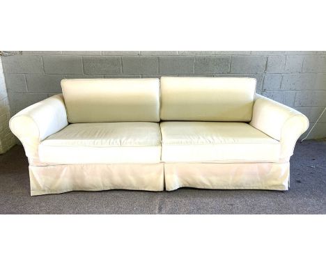 A pair of white modern sofa’s, each with two large seat cushions and curved backs, in cream/ white fabric, loose covers are r