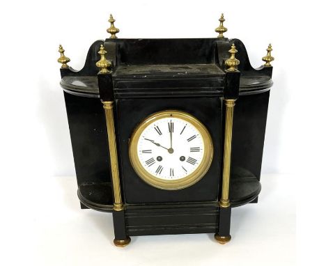 A Victorian Architectural ebonized mantel clock, late 19th century, with a barrel movement, striking on a bell, enamel face a