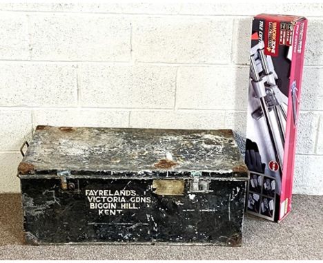 A large vintage black painted tin trunk; together with a boxed modern tile cutter (2)