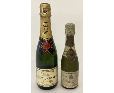 2 vintage small bottles of Champagne. A bottle by Moet &amp; Chandon and a bottle by Pol Roger.  For display purposes only. N