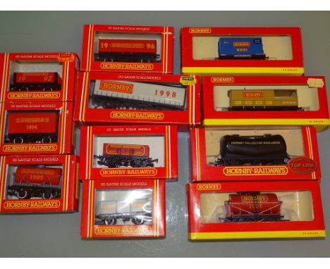 A large group of HORNBY Railways OO Scale Collectors' Club vans and wagons as lotted - VG in F/G boxes as lotted (11)