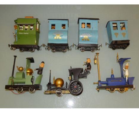 3 unboxed kit/scratch built locomotives with four coaches and figures, possibly modelled in the style of ROWLAND EMETT.  Buil