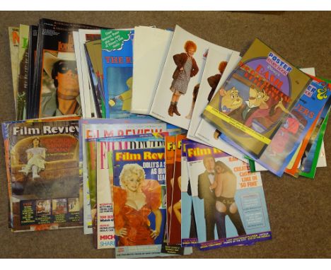 A large quantity of 'Film Review' magazines and DISNEY story books, programmes etc together with a large 'ANNIE' character po