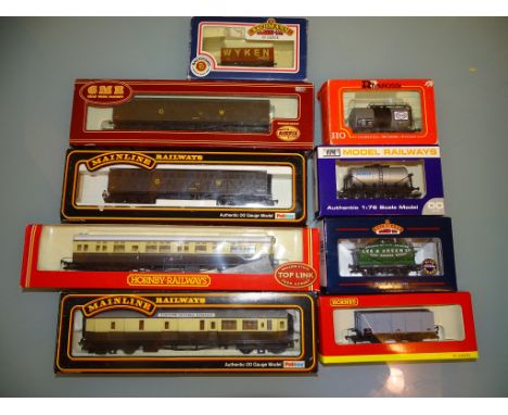 A group of wagons and coaches by various manufacturers to include MAINLINE, HORNBY Railways, BACHMANN, RIVAROSSI, AIRFIX and 