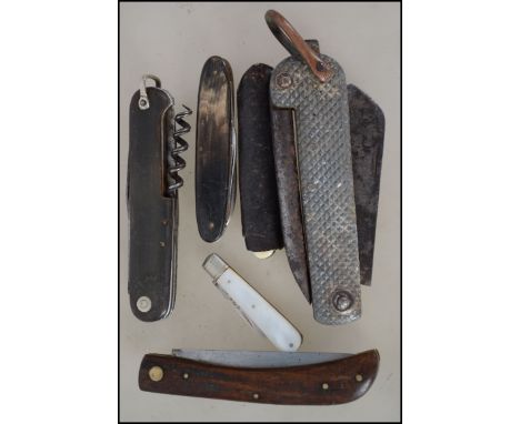 A collection of vintage pen knives - penknives to include military, bone handled etc. Also with a mother of pearl and silver 