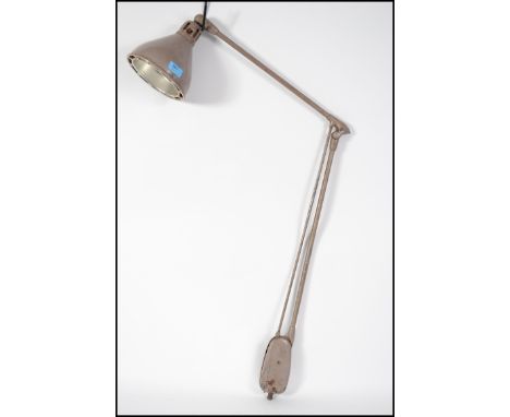 A vintage mid 20th century unusual angle poise style machinist lamp in the original paint finish with a fitted conical shade.
